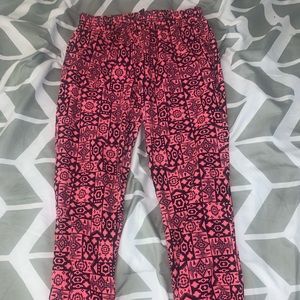 these pants are pink with designs & a size 10/12 L